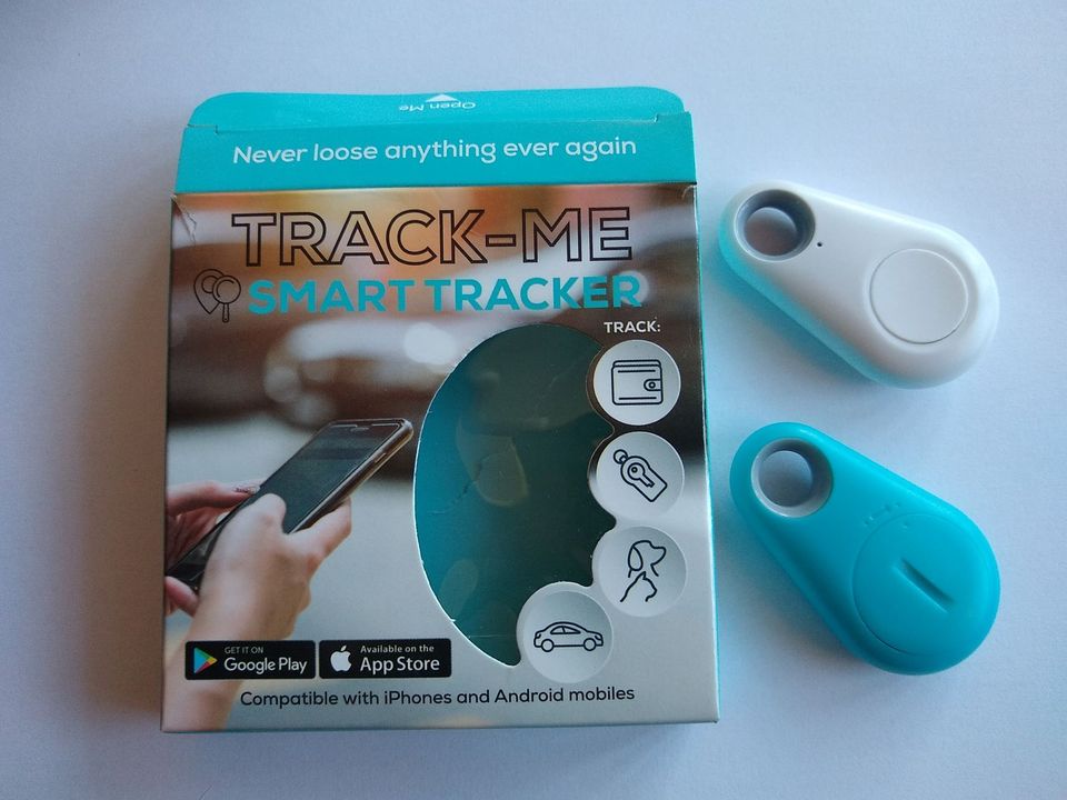 Two tracker fobs and their retail packaging